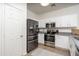 Modern kitchen featuring stainless steel appliances and white cabinets at 7028 W Lincoln St, Peoria, AZ 85345