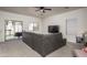 This spacious living area has carpeted floors, and sliding door access to the back yard at 7028 W Lincoln St, Peoria, AZ 85345