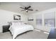 Large main bedroom with a ceiling fan and lots of natural light at 7028 W Lincoln St, Peoria, AZ 85345