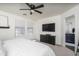 Bright main bedroom with ensuite bathroom featuring modern furniture and plenty of natural light from windows at 7028 W Lincoln St, Peoria, AZ 85345