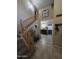 Inviting entryway features tile flooring, wood staircase, and stylish decor for a warm welcome at 7240 W Los Gatos Dr, Glendale, AZ 85310