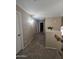 Upstairs hallway featuring neutral walls and carpeted floors with access to multiple rooms at 7240 W Los Gatos Dr, Glendale, AZ 85310
