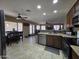 Open-concept kitchen boasts granite countertops, stainless steel appliances, and seamless flow to the living area at 7240 W Los Gatos Dr, Glendale, AZ 85310