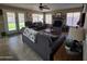 Large living room featuring an open floor plan, fireplace, and plenty of natural light at 7240 W Los Gatos Dr, Glendale, AZ 85310
