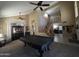Spacious living room with stairs, decorative furnishings, and high ceilings with ceiling fans at 7240 W Los Gatos Dr, Glendale, AZ 85310