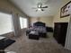 Large main bedroom features natural lighting, ceiling fan, plush carpet, and ample closet space at 7240 W Los Gatos Dr, Glendale, AZ 85310