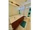 Well-lit bathroom with double sinks, a large mirror, and a shower-tub combination, offering convenience and functionality at 7310 W Pioneer St, Phoenix, AZ 85043
