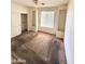 Bedroom with neutral walls, built-in shelving, and a closet providing storage solutions, ready for personalization at 7310 W Pioneer St, Phoenix, AZ 85043