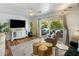Bright living room with seamless access to outdoor living, and trendy gold accents at 7608 E Avalon Dr, Scottsdale, AZ 85251