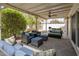 Outdoor living area with comfortable seating and a ceiling fan for relaxing and entertaining at 7608 E Avalon Dr, Scottsdale, AZ 85251