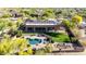 Aerial view featuring a home, pool, well-kept lawn, and a functional garden area at 7848 E Parkview Ln, Scottsdale, AZ 85255
