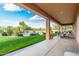 Outdoor covered patio showcases a green lawn, garden, and views of the surrounding landscape for entertainment at 7848 E Parkview Ln, Scottsdale, AZ 85255