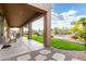 Covered patio overlooking backyard oasis with pool, landscaping, and stone pathway for relaxed outdoor living at 7848 E Parkview Ln, Scottsdale, AZ 85255