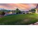 Large grassy backyard with landscaping, gardening beds, and perimeter fencing offering privacy and space at 7848 E Parkview Ln, Scottsdale, AZ 85255