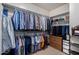 Walk-in closet with ample hanging space and built-in storage shelves at 7848 E Parkview Ln, Scottsdale, AZ 85255
