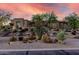 Desert landscaping in front of home, creating a beautiful curb appeal with native plants and modern architectural design at 7848 E Parkview Ln, Scottsdale, AZ 85255