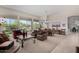 Open concept living room with neutral color scheme, large windows, and elegant furnishings, ideal for comfortable living at 7848 E Parkview Ln, Scottsdale, AZ 85255