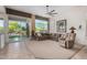 Bright living room with large windows, plush seating, and stylish decor, creating an inviting and comfortable atmosphere at 7848 E Parkview Ln, Scottsdale, AZ 85255