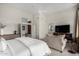 Primary suite with neutral decor, ceiling fan, sitting area, and ensuite bath at 7848 E Parkview Ln, Scottsdale, AZ 85255