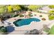 The kidney-shaped backyard pool has desert landscaping and rock waterfall features at 7848 E Parkview Ln, Scottsdale, AZ 85255