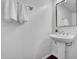 Modern half-bath with pedestal sink and decorative mirror at 7977 W Wacker Rd # 134, Peoria, AZ 85381