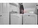 Convenient laundry room with washer, dryer, storage shelves, and ample space at 7977 W Wacker Rd # 134, Peoria, AZ 85381