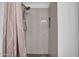 Modern tiled shower with hexagon tile floor, a built-in niche, and chrome fixtures at 7977 W Wacker Rd # 134, Peoria, AZ 85381