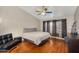 Bedroom with wood floors, fan, and accent furniture at 8531 E Natal Cir, Mesa, AZ 85209