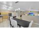 Open-concept dining area with modern lighting, seamless flow to kitchen and living area at 8531 E Natal Cir, Mesa, AZ 85209