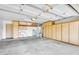 Well-lit two car garage with built-in cabinets, utility sink and water heater at 8531 E Natal Cir, Mesa, AZ 85209
