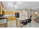 Spacious kitchen featuring a large island with seating, stainless appliances, and tile flooring at 8531 E Natal Cir, Mesa, AZ 85209