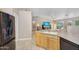 Open kitchen featuring an island with a sink and view to living space at 8531 E Natal Cir, Mesa, AZ 85209