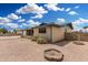 Rear view of the property highlighting the yard space and brick exterior, ready for personalization at 900 S Palo Verde Dr, Apache Junction, AZ 85120