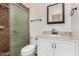 Bathroom featuring a stand up shower with glass door, vanity with granite countertop and mirror at 900 S Palo Verde Dr, Apache Junction, AZ 85120