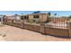 Charming single story brick home featuring secure fenced yard with minimal landscaping at 900 S Palo Verde Dr, Apache Junction, AZ 85120