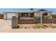 Single story brick home with a well manicured front yard and inviting curb appeal at 900 S Palo Verde Dr, Apache Junction, AZ 85120