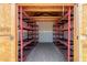 Interior of shed with metal shelving on both sides, offering ample storage space for tools and equipment at 900 S Palo Verde Dr, Apache Junction, AZ 85120