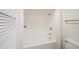Clean white bathroom with a shower and a toilet, complemented by a towel rack at 9613 W Shasta Dr, Sun City, AZ 85351