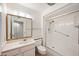 Well-maintained bathroom featuring shower, tile floors, and a large vanity mirror at 9613 W Shasta Dr, Sun City, AZ 85351