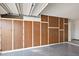 Spacious garage interior featuring built-in storage cabinets on the wall at 9613 W Shasta Dr, Sun City, AZ 85351