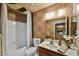Full bathroom with tub shower combo, toilet, and vanity sink with mirror at 9645 W Kimberly Way, Peoria, AZ 85382
