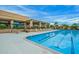 Inviting community pool with lounge chairs and shaded seating areas, perfect for relaxation at 9645 W Kimberly Way, Peoria, AZ 85382
