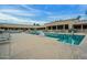 Community pool with lounge chairs and building in the background at 9645 W Kimberly Way, Peoria, AZ 85382