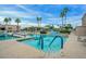Community pool with lounge chairs and palm trees at 9645 W Kimberly Way, Peoria, AZ 85382
