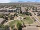Overhead shot displays community park with playground within a Gathering-friendly neighborhood setting at 10442 W Toronto Way, Tolleson, AZ 85353