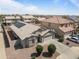 Aerial view of single-story home with solar panels and desert landscaping at 10442 W Toronto Way, Tolleson, AZ 85353