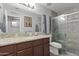 Updated bathroom with granite counters, mosaic tile, and a glass shower at 10442 W Toronto Way, Tolleson, AZ 85353
