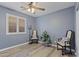 Bedroom with a ceiling fan and hardwood floors and vintage-style decor at 10442 W Toronto Way, Tolleson, AZ 85353