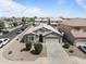 Aerial view of single-story home with two car garage and desert landscaping at 10442 W Toronto Way, Tolleson, AZ 85353