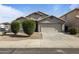 Charming single-story home with a two car garage and low maintenance desert landscaping at 10442 W Toronto Way, Tolleson, AZ 85353